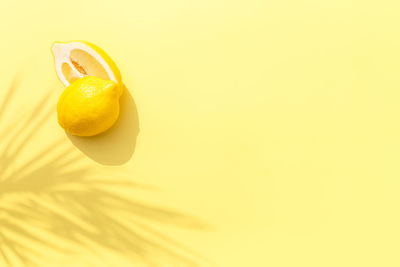 Close-up of yellow fruit against orange background