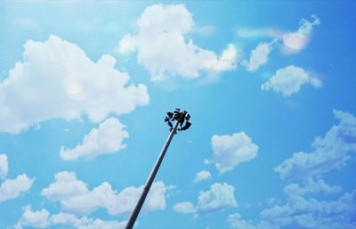 Low angle view of insect against blue sky