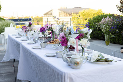 Wedding table setting on a roof with a beautiful view of the city