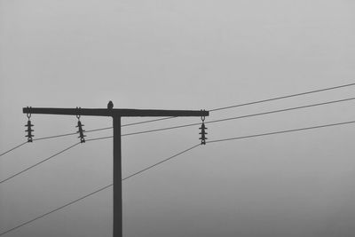 Low angle view of electricity pylon