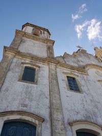 Low angle view of old building against sky