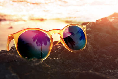 Close-up of sunglasses on glass