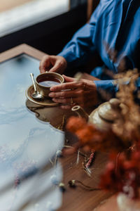 Woman's hands holding coffee