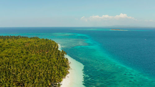 Small island with beautiful beach, palm trees.patongong island with sandy beach