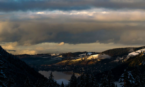 Scenic view of mountains against cloudy sky