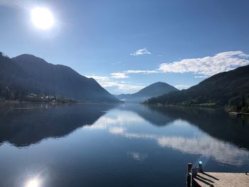 Scenic view of lake and mountains against sky