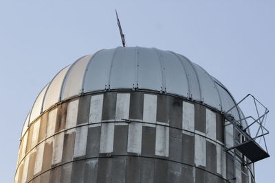 Low angle view of water tower against clear sky