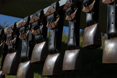 Close-up of padlocks hanging on metal