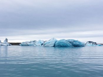 Scenic view of frozen sea against sky