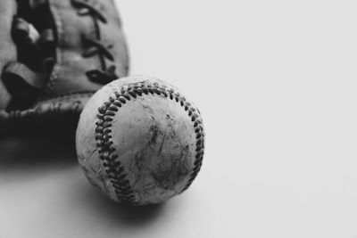 Close-up of ball on table against white background