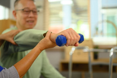 Midsection of woman exercising in gym