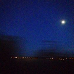 Scenic view of landscape against sky at night