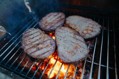 High angle view of meat on barbecue grill