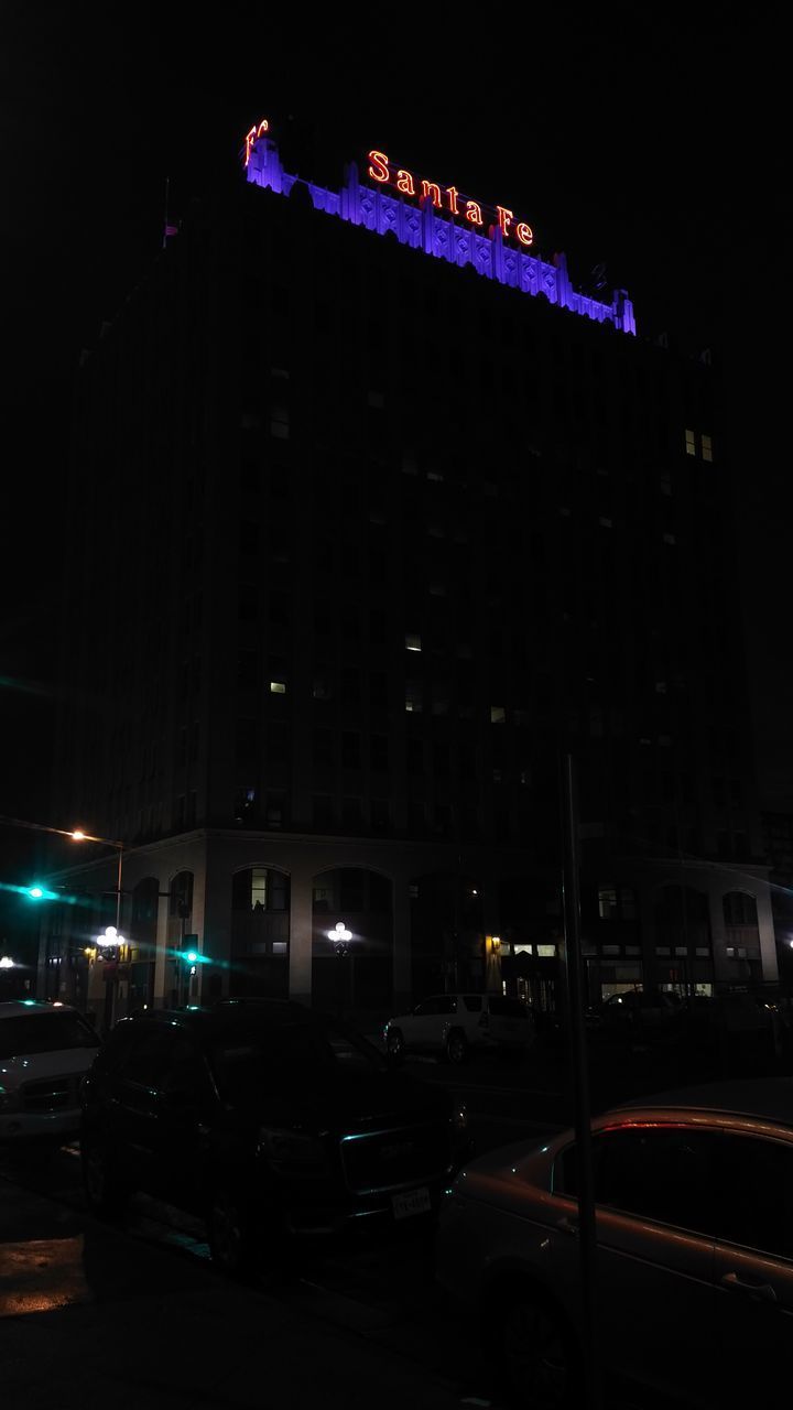 ILLUMINATED CITY STREET AT NIGHT