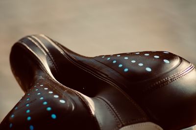 Close-up of shoes against black background