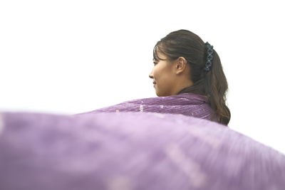 Young woman over white background