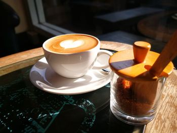 Close-up of coffee cup on table