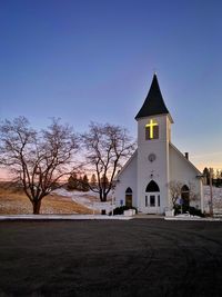 View of building and trees against sky