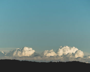 Low angle view of silhouette mountain against sky