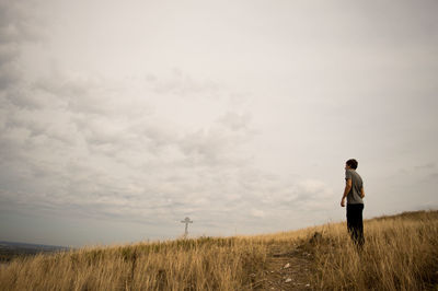 Full length of woman standing on grassy field