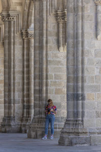 Full length of a woman standing in temple