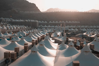 High angle view on illuminated tents in city at sunset