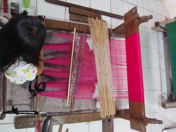 Rear view of girl hanging on clothesline