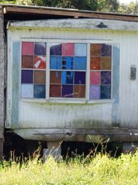 Close-up of house window on field