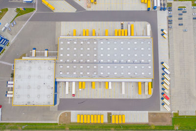 Aerial view of goods warehouse. logistics delivery center in industrial city aerial view of trucks 