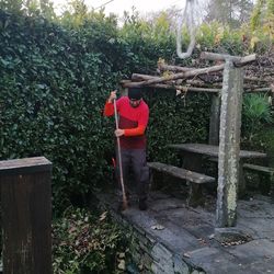 Rear view of man standing against trees