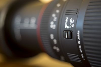 Close-up of camera lens on table