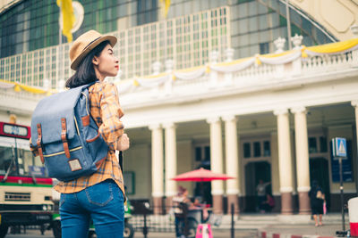 Full length of woman standing in city