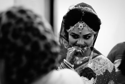 Smiling beautiful bride in wedding ceremony