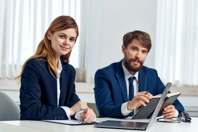 Portrait of business people sitting in office