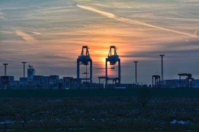 Traditional building against sky during sunset