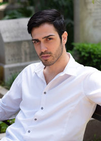 Portrait of young man standing outdoors