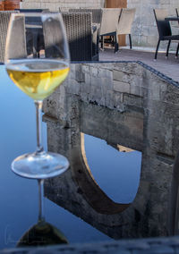 Close-up of wineglass on table at sidewalk cafe