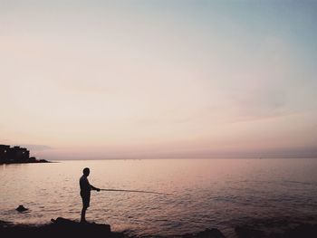 Scenic view of sea at sunset