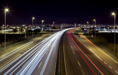 High angle view of light trails on street at night