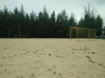 View of soccer field against trees