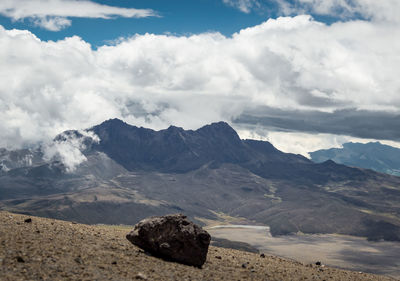 Scenic view of mountain against cloudy sky