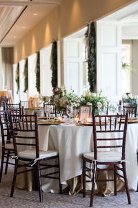 Empty chairs and tables in restaurant