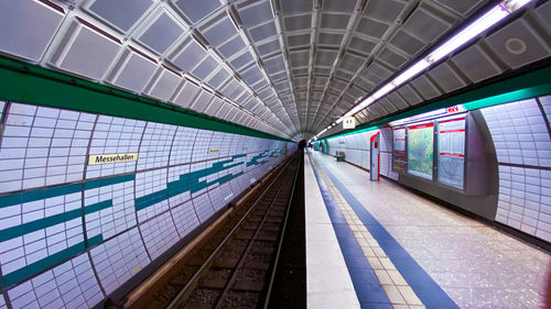 Illuminated subway station in city