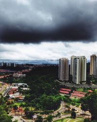 Buildings against cloudy sky