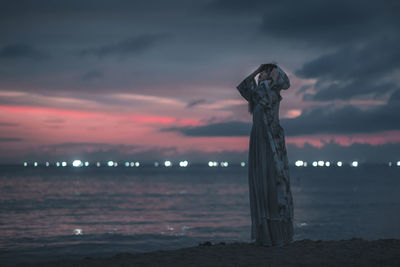 Low angle view of statue against sky during sunset