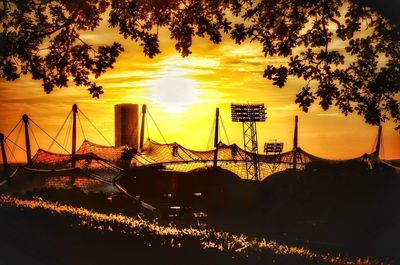 Silhouette of suspension bridge during sunset