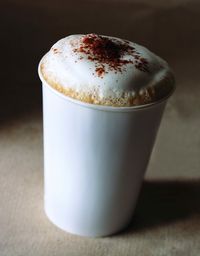 Close-up of coffee cup on table