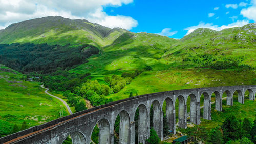 Arch bridge against sky