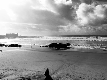 Scenic view of sea against cloudy sky