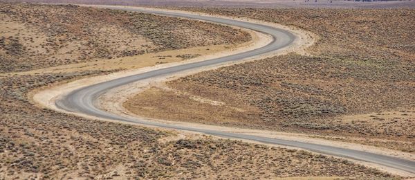 High angle view of road passing through desert